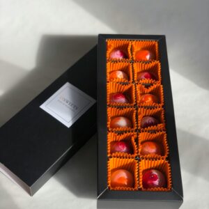 Luxurious selection of chocolates in an elegant box, perfect for gifting and indulgence.